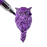 Purple fantasy creature figurine with a detailed design on a white background