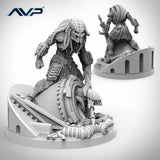 Gray scale model of an alien creature on a white background with 'AVP' logo.