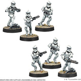 Six stormtrooper miniatures on round bases with a white background